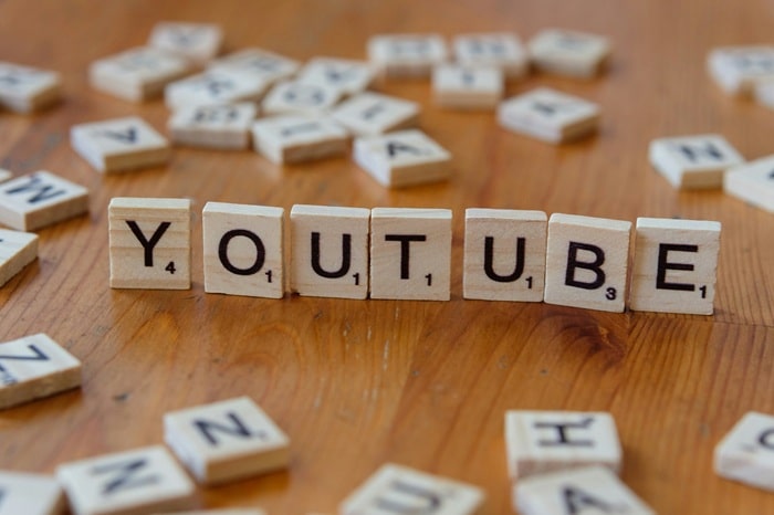 Wood blocks create the word "YOUTUBE"