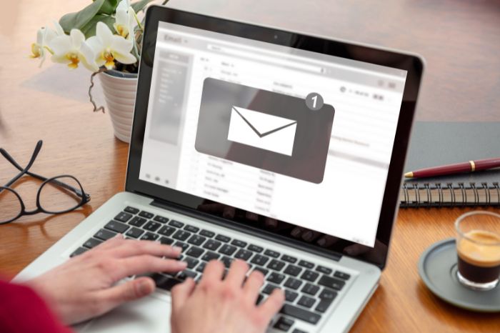Business owner searches on her laptop. She needs to know what Is the best free email provider