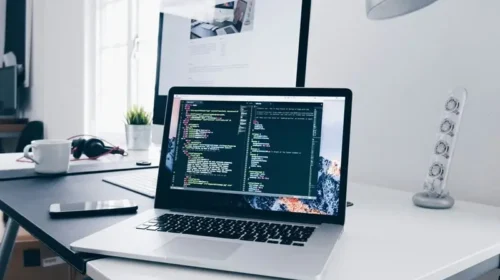 Laptop with coding on the screen symbolizing blog security and WordPress website protection.
