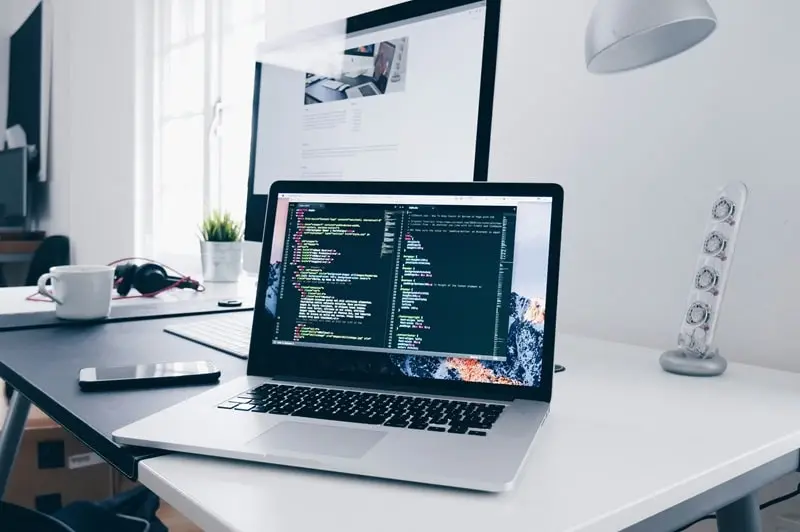 Laptop with coding on the screen symbolizing blog security and WordPress website protection.